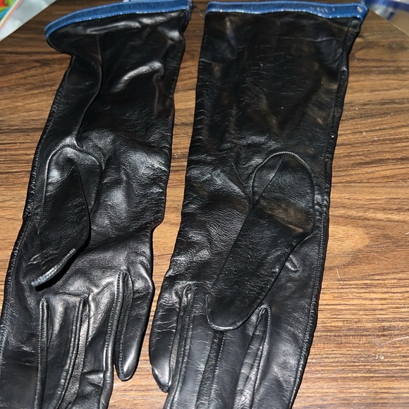 Coach black long leather zip up gloves with gold metallic hardware and d…